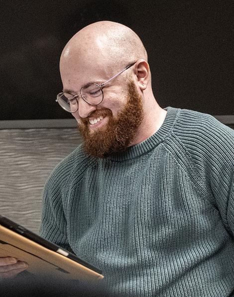 Eden Bailey is reading a poem in a classroom