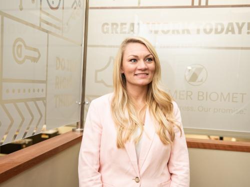 Student poses at an internship.