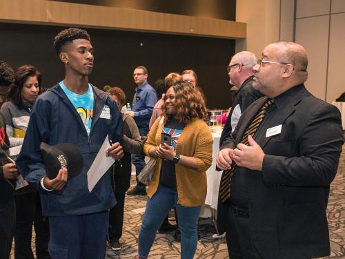 Ken Christmon talks to a new student.