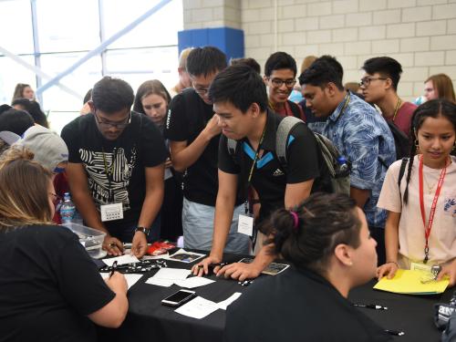 Students at booth at event