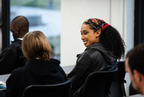 Students chat in the IDEA Space in Helmke library.