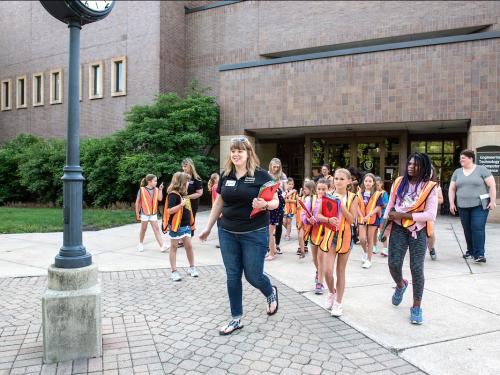 Children walking on campus