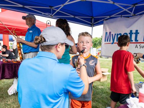 Child being taught how to play instrument