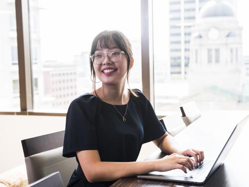 A female accounting student in a downtown office