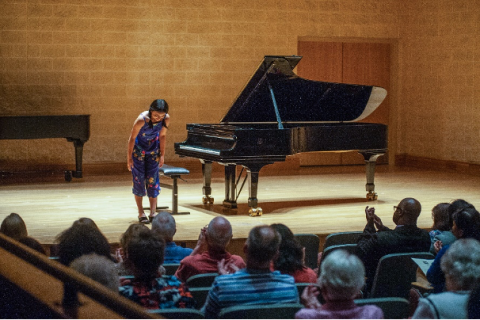 Student playing piano