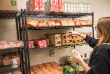 Student shopping at the food pantry facility.