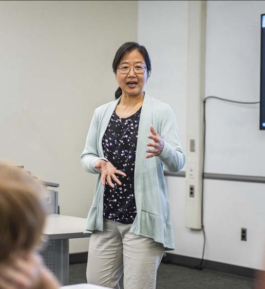 Professor Chao Chen teaching in a classroom