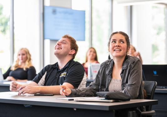 Students enjoy a lecture.