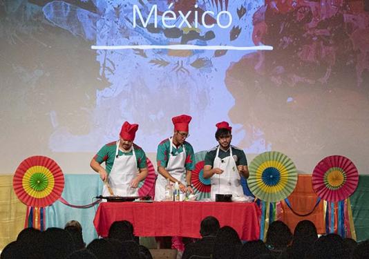 This colorful trio demonstrated how to create traditional Mexican tacos in front of a large audience in Walb Union, one of many presentations of traditions from around the world at the annual Global Student Celebration 