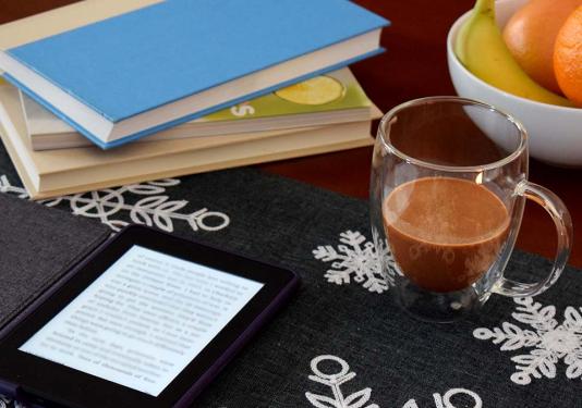 Books with coffee and fruit