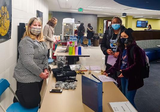 Staff members at a minor match-up event in Kettler Hall