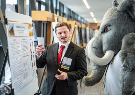 Student presenting poster