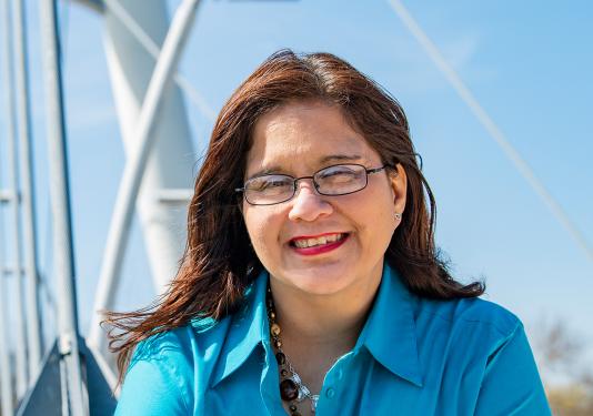 Elva Resendez in front of the Venderly Bridge