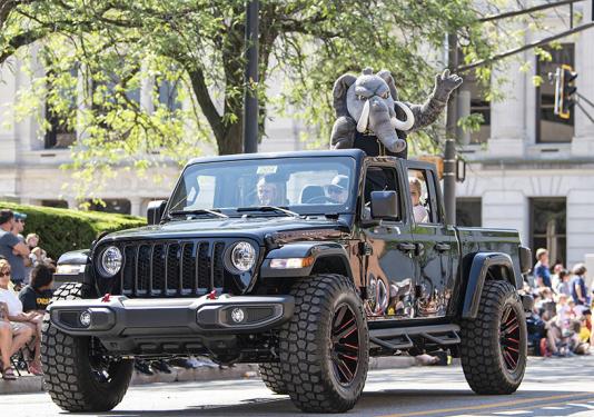 Don the Mastodon rides a jeep in the Three Rivers Festival Parade