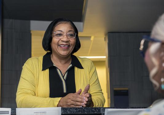 Dimples Smith meets with a client in her office