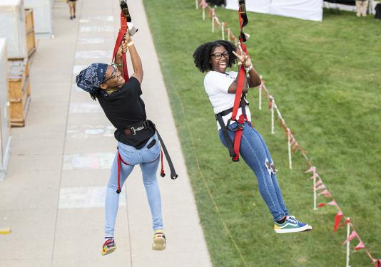 And the race is on for two PFW students ziplining at the annual Picnic on the Lawn on Sept. 7