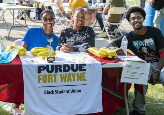 T. Hardy (center) and fellow Black Student Union members Alicia Kingsberry and Collins Karanja at a student event.