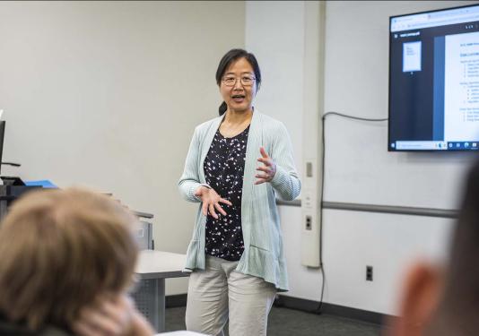 Professor Chao Chen teaching in a classroom