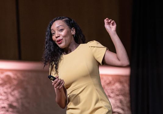 Omnibus speaker Moogega Cooper speaks to the audience in Auer Performance Hall
