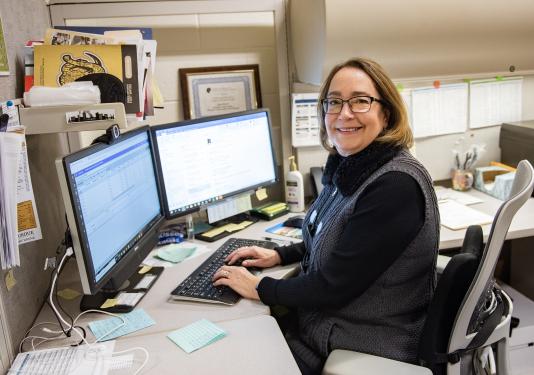 Jana Lese is working at her desk