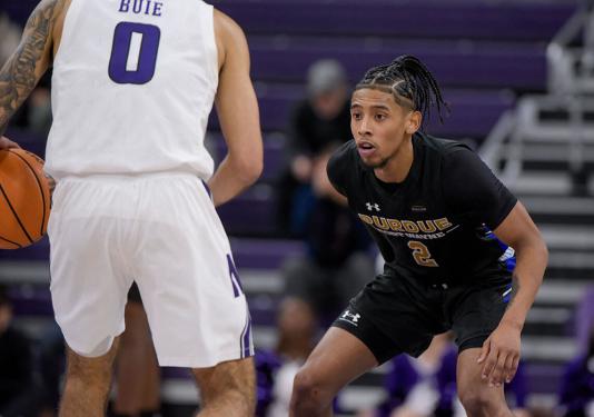 Damian Chong Qui is playing basketball.
