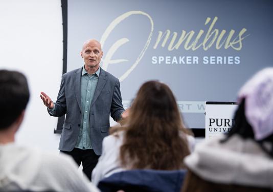 Scott Dikkers speaks to a group of students