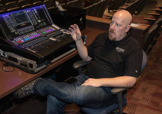 Tom Wilson is relaxing beside a sound board
