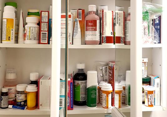 Open medicine cabinet displaying medications