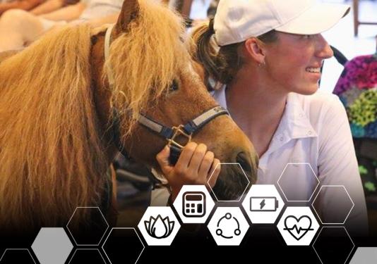 Young woman with miniature horse at the 2023 Well-being Summit