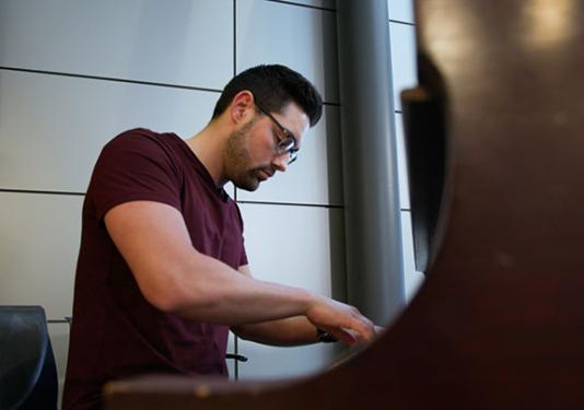 Preston Graber is playing the piano.