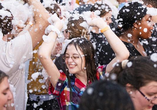 Lilly Stotlar is dancing in foam bubbles.