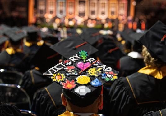 A graduate with a decorated cap.