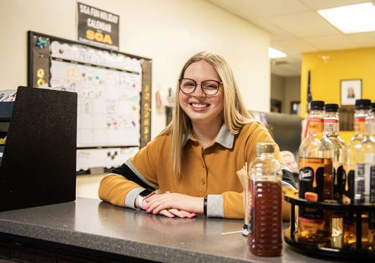 Mikayla Haggarty behind the desk in the Student Government office.