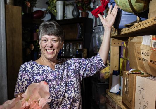 Susan Domer is in a theatre prop storage room