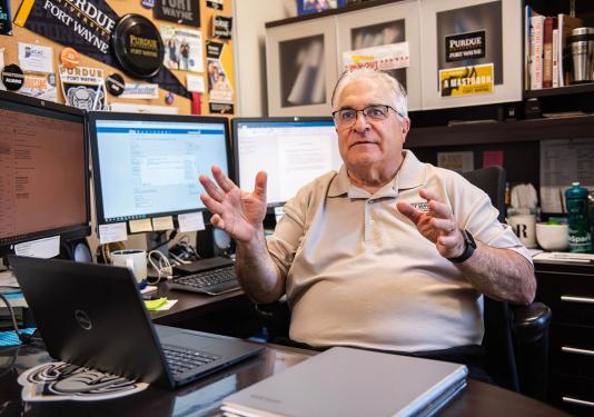 Roy Danielian is talking to someone in his office