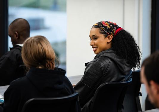Students chat in the IDEA Space in Helmke library.