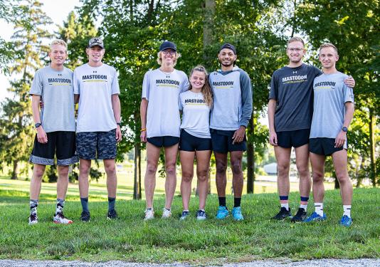Seven cross country teams members who are twins