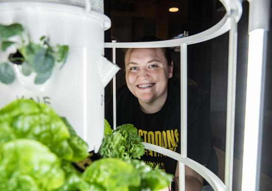 Rachel Hendryx is behind a hydroponic garden tower
