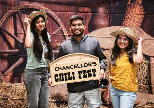 Three students at the Chancellor's Chili Fest