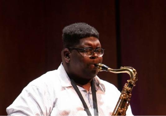 Katahj Copley playing saxophone
