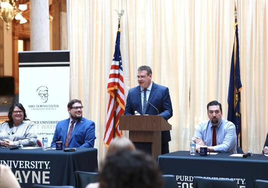 Michael Wolf is leading a panel discussion at the Indiana Statehouse