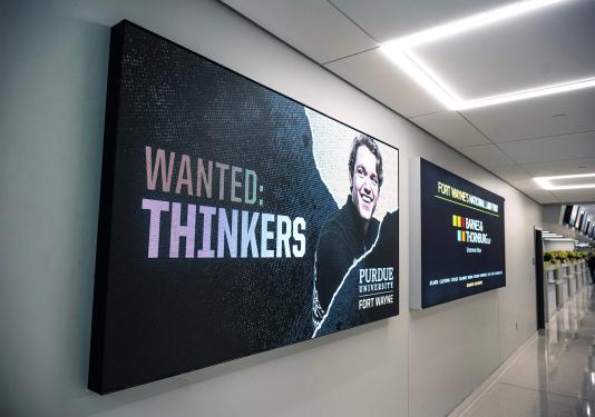 A Purdue Fort Wayne ad in the Fort Wayne International Airport.