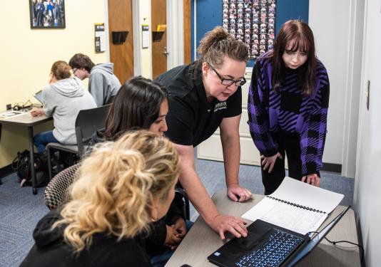 Financial Aid team members help students with their FAFSA forms.