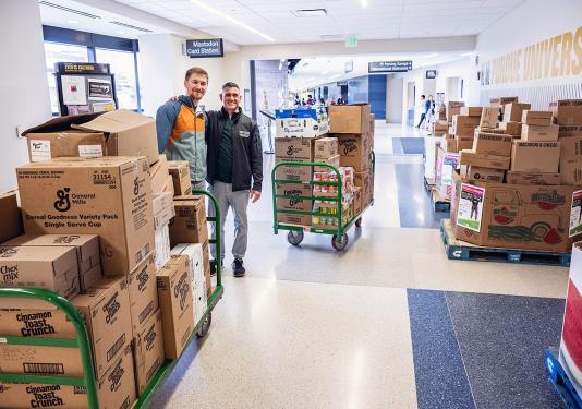 Boxes of food fill a hallway