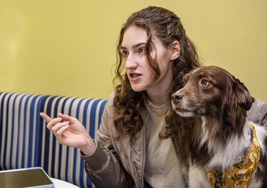 Emily Wentland and her therapy dog, Gunner.