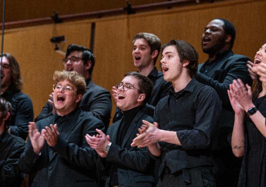 choir singing and clapping