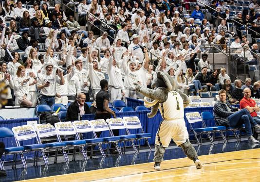 Don the Mastodon fires up the Herd at a homecoming game.
