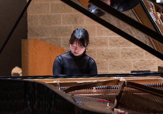 woman playing piano