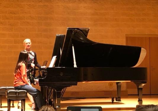 young girl playing piano