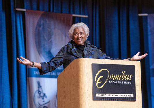 Donna Brazile is speaking onstage in the Auer Performance Hall